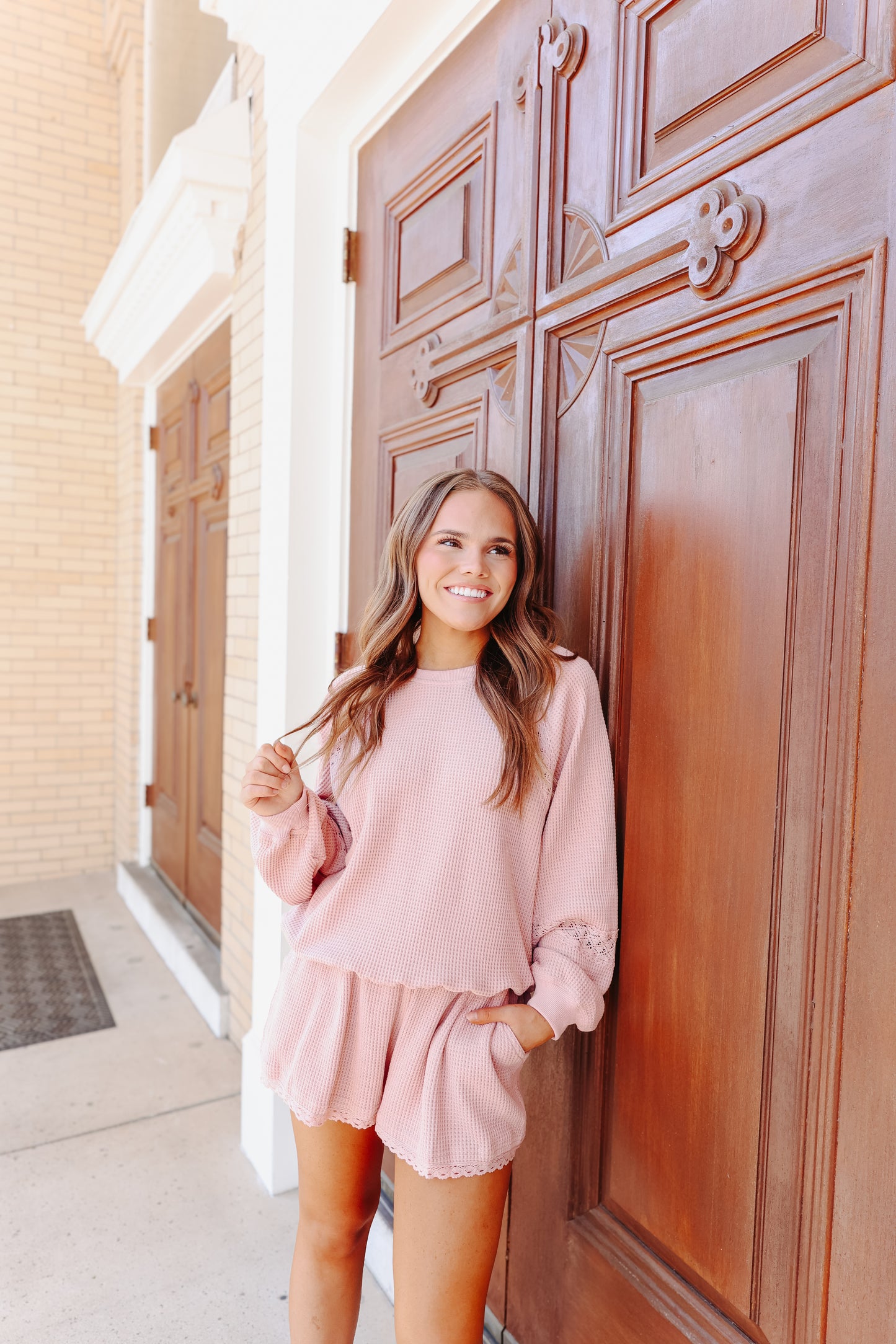 Model wearing light pink waffle knit lace trim set.