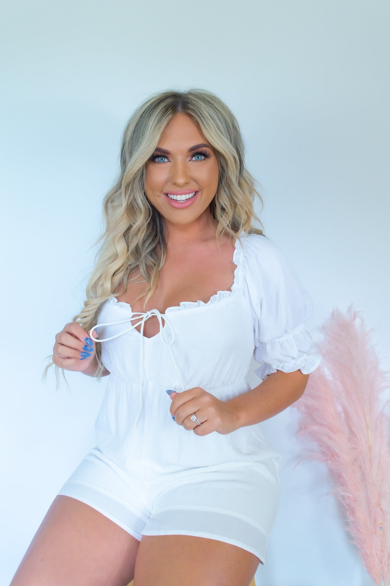White romper country music outfit white ruffle romper short romper ruffle detailing Nashville outfit summer romper lightweight romper suede boots country music concert outfit